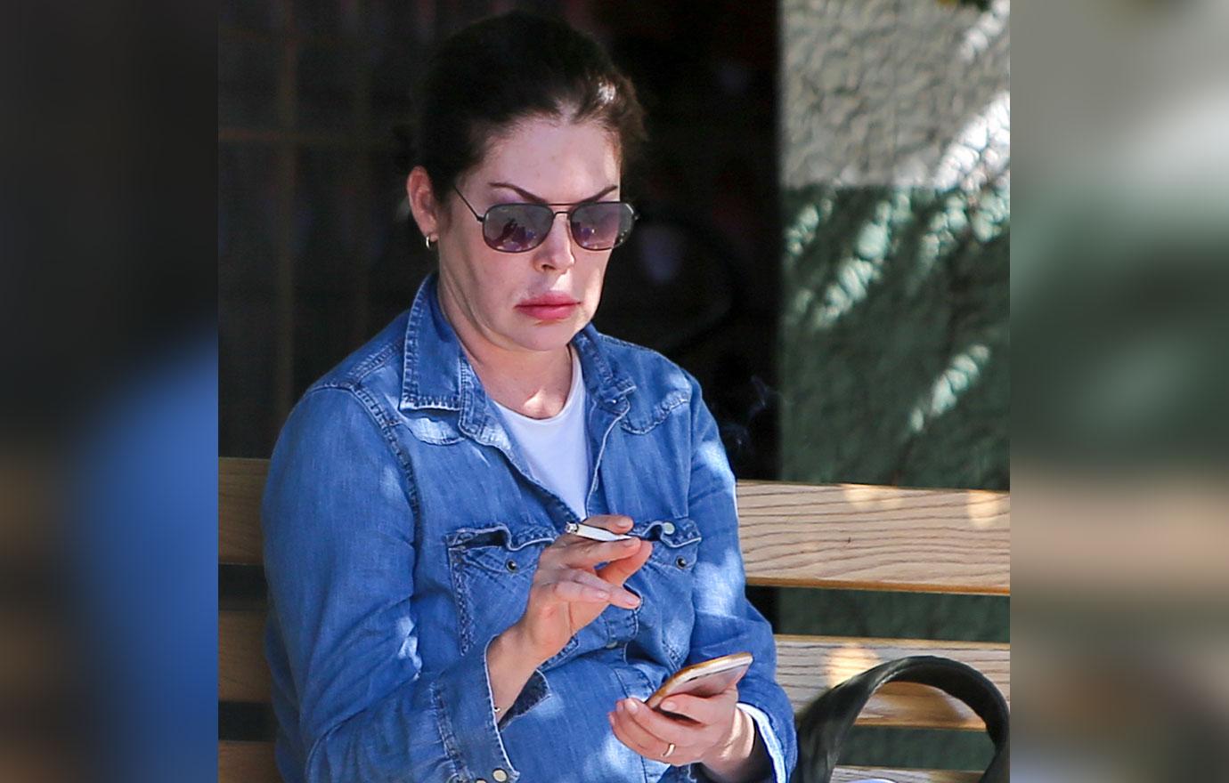 Lara Flynn Boyle Wearing Sunglasses, Denim Shirt, White T-Shirt and White Jeans