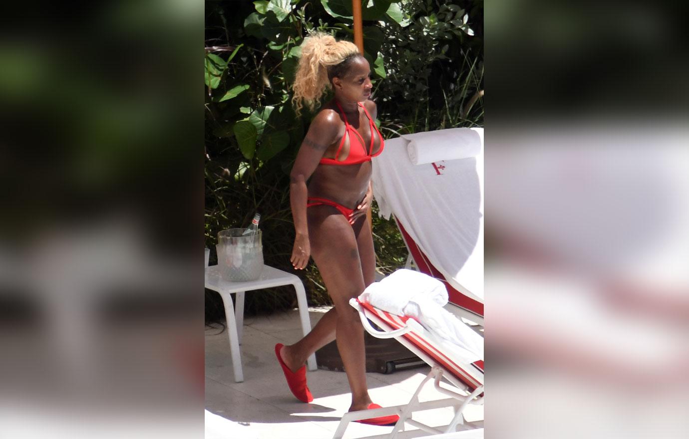 Mary J. Blige hits the beach in bejeweled blue bikini