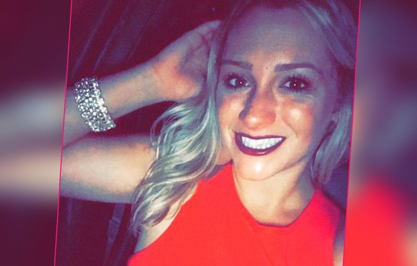 Savannah Spurlock takes a selfie in a red dress.