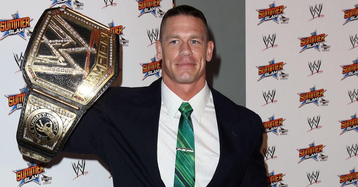 John Cena holding up the WWE Championship belt