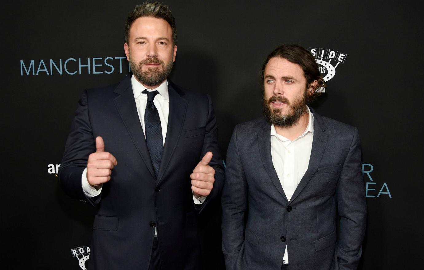 Ben Affleck gave two thumbs up as he wore a black suit and tie alongside brother Casey Affleck, who wore a grey suit with a white shirt and no tie.