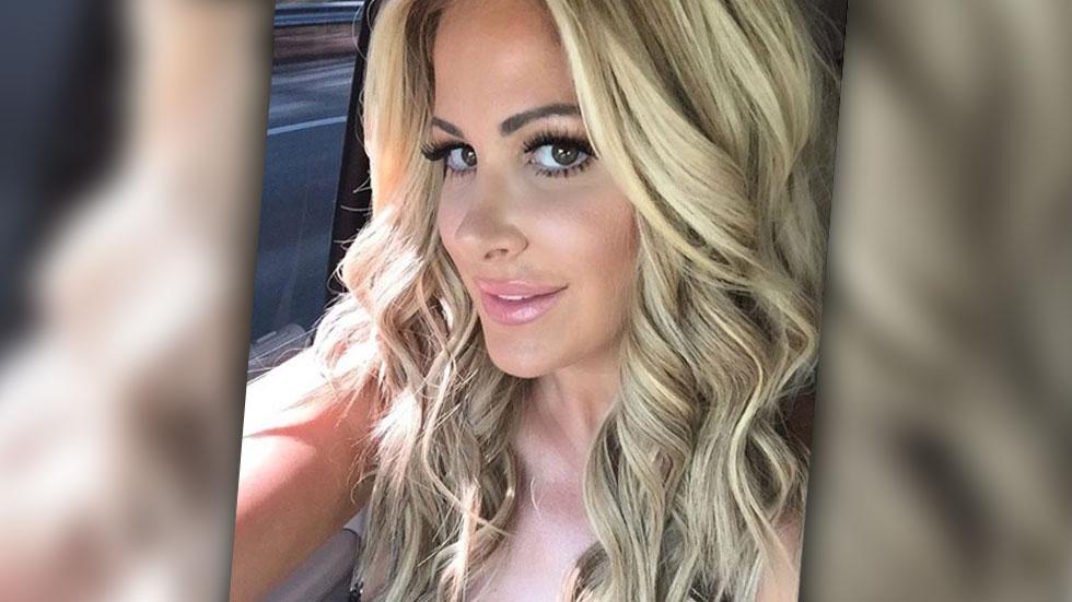 Topless Kim Zolciak uses cowboy hat to cover her chest for new