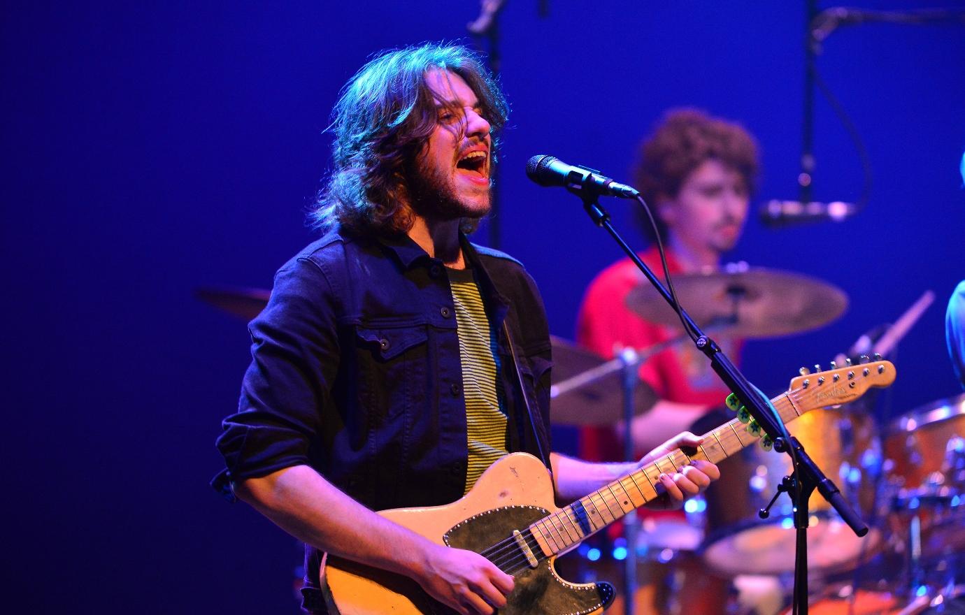 Conor Kennedy singing onstage