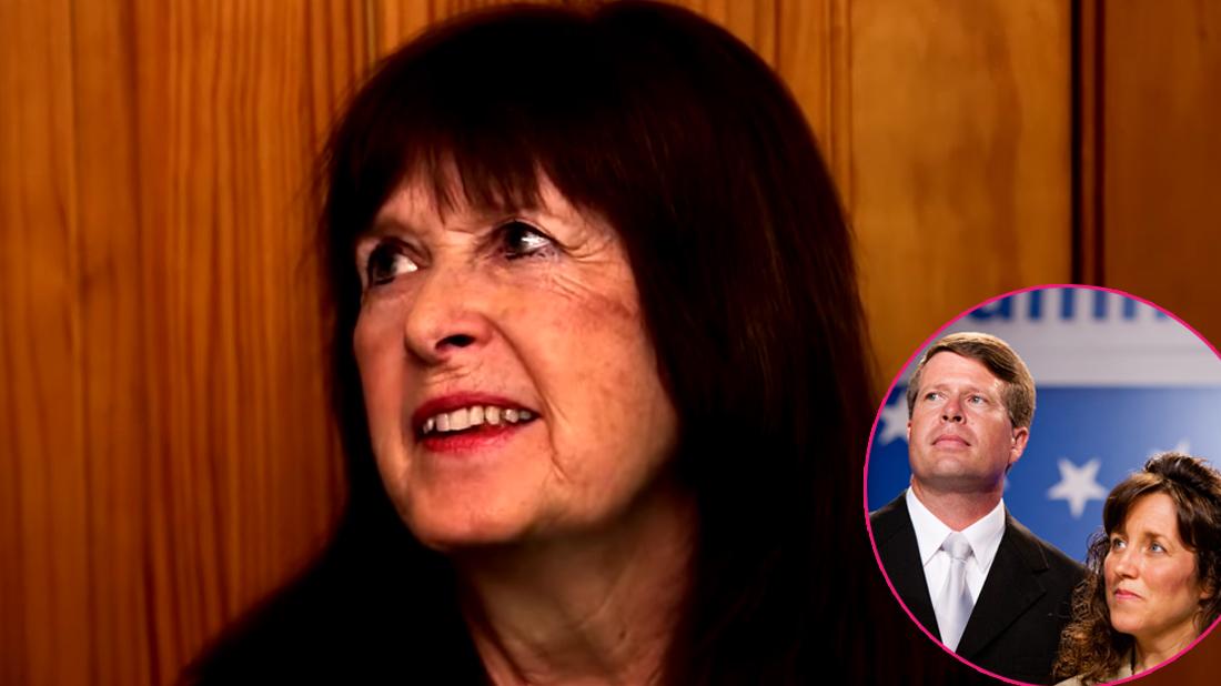 mary duggar stands in front of a door. Jim Bob Duggar, wearing a suit with a tie, and Michelle Duggar, wearing a black shirt are insetted in the right hand side of the graphic.