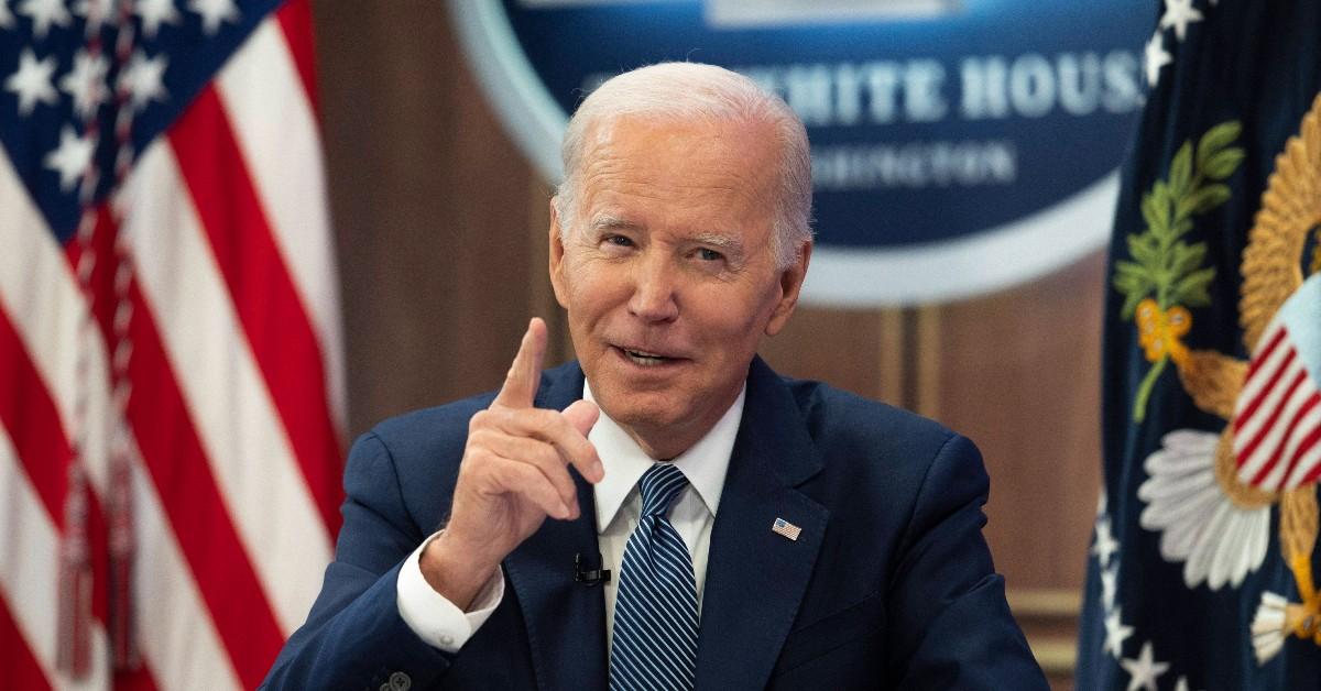 Photo of Joe Biden raising finger in White House.