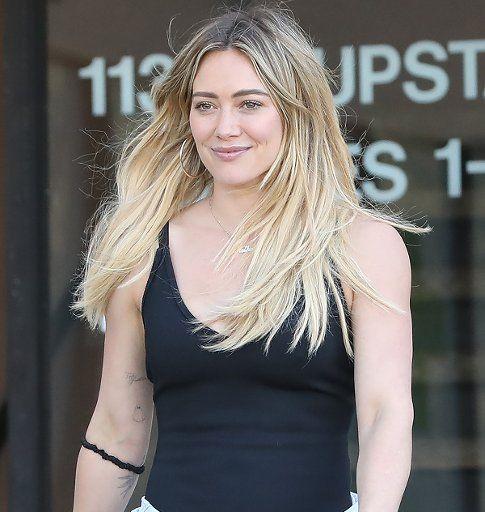 Hilary Duff recalled a psychic asking 'Are you Hilary Duff?' after sensing Aaron Carter during a reading.