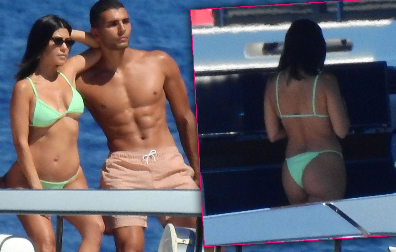 https://media.radaronline.com/brand-img/JMh8troZn/0x0/2018/06/kourtney-kardashian-wears-bikini-on-yacht-with-beau-younes-bendjima-and-kids-pp-.jpg