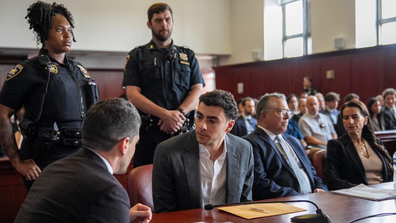 Luigi Mangione seated in court