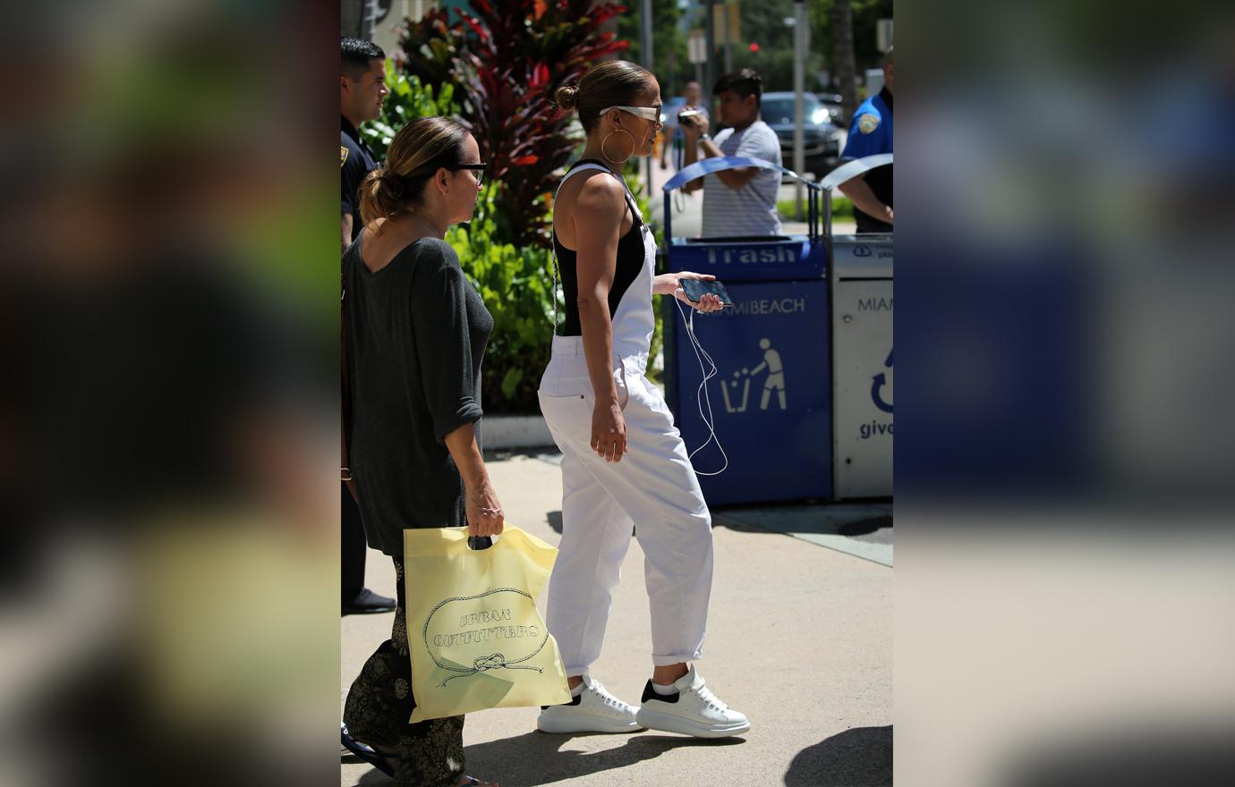 Jennifer Lopez takes her twins Max and Emme shopping at the Lincoln Road Mall in Miami. The group stopped by an Urban Outfitters store to peruse the selection.