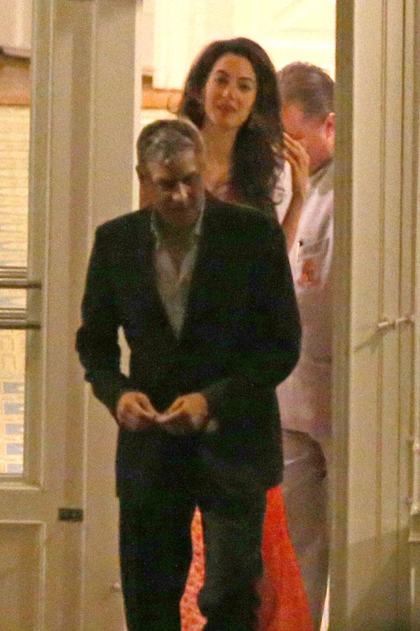 //george clooney amal clooney dinner italy kiss hold hands