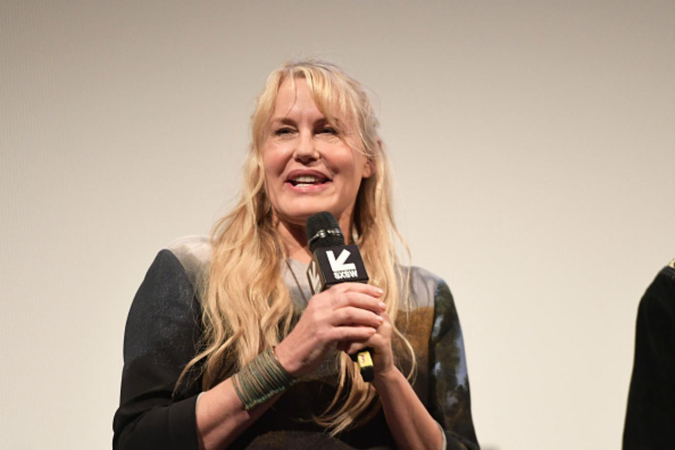 Daryl Hannah speaks into a microphone.