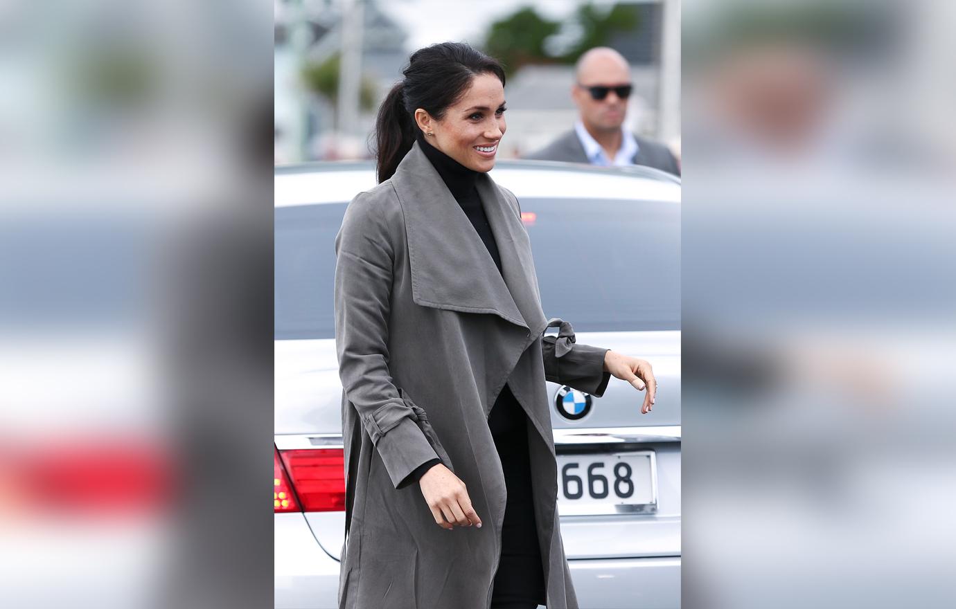 Meghan Markle Covers Baby Bump With A Coat