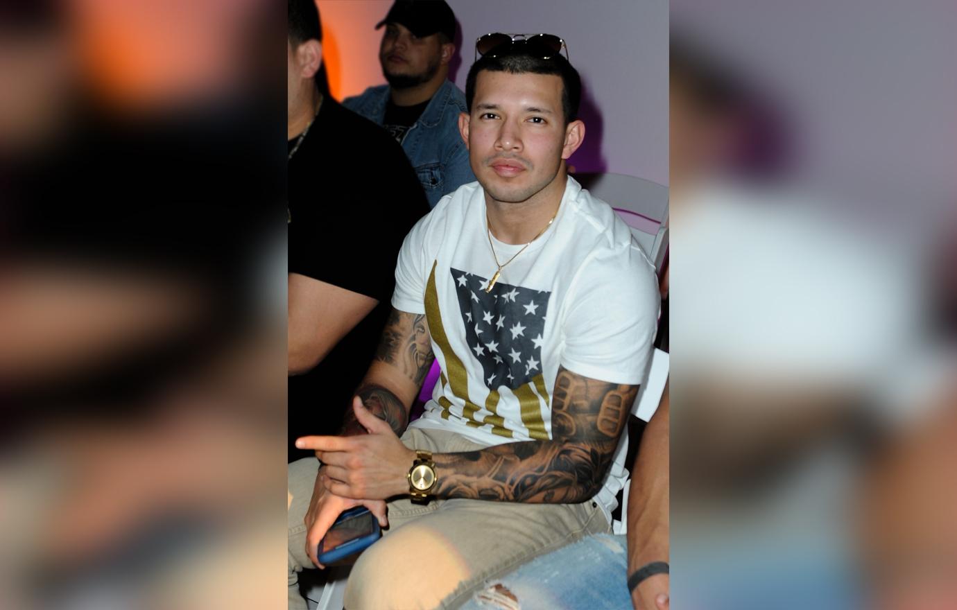 Javi Marroquin Sitting With Serious Expression at Fashion Show