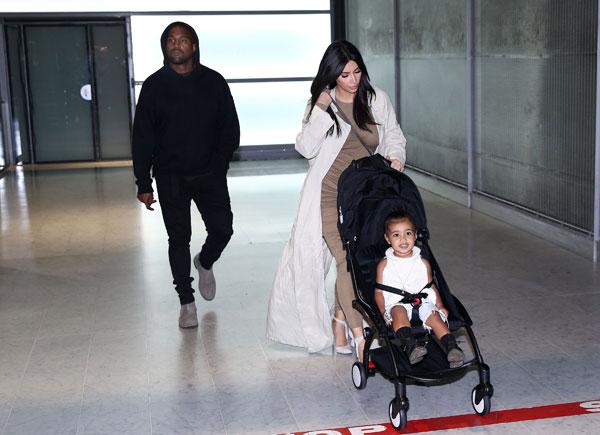 Kim Kardashian Kanye North West Photos -- Toddler Smiles As Family Arrives In Paris