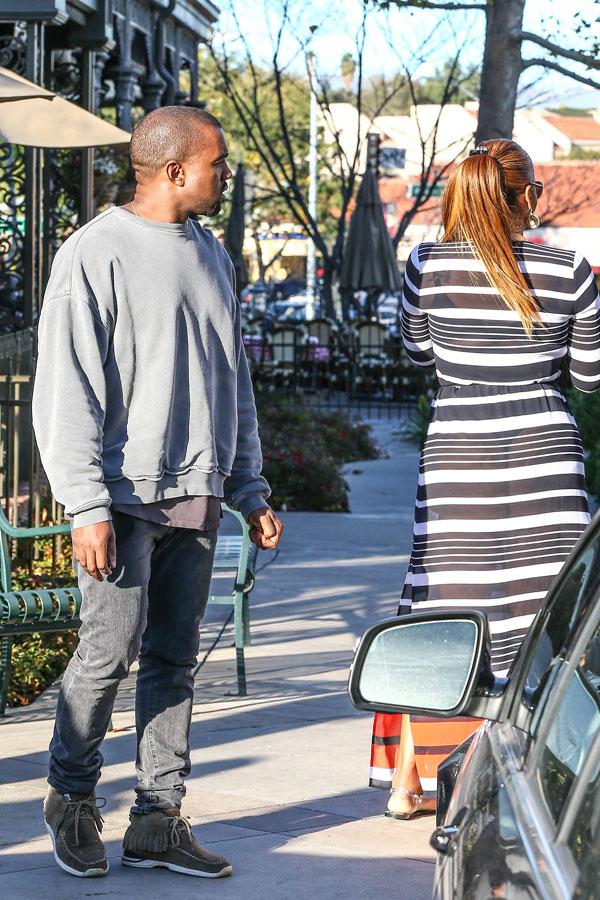 //kanye west caught checking out womans butt​