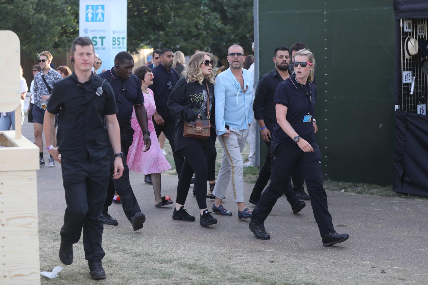 Adele holds hands with a male friend en route to watch Celine Dion in Hyde Park, London.