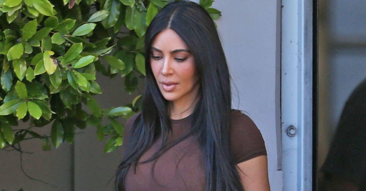 Photo of Kim Kardashian is brown bodysuit.