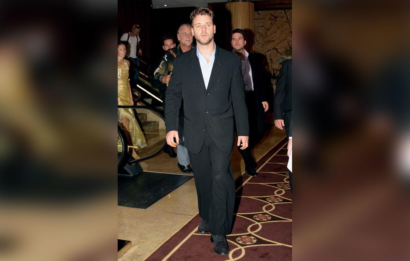 Russell Crowe Shows Off Weight Gain While With New Assistant