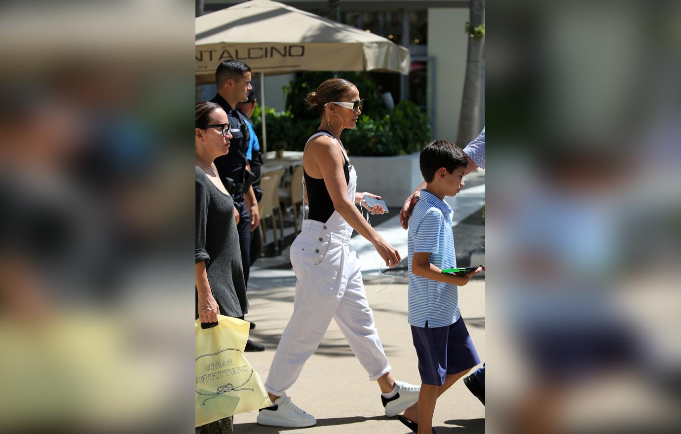 Jennifer Lopez takes her twins Max and Emme shopping at the Lincoln Road Mall in Miami. The group stopped by an Urban Outfitters store to peruse the selection.