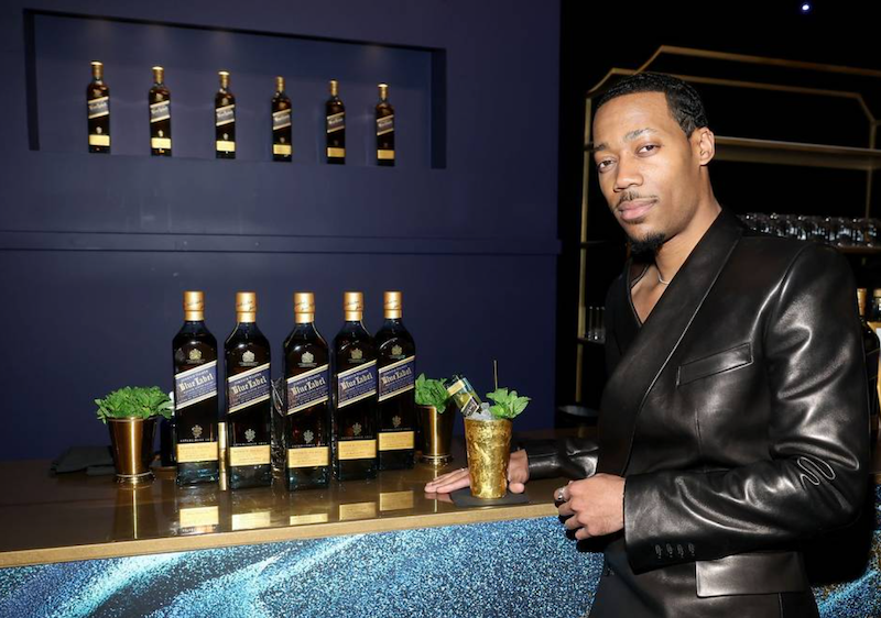 tyler james williams celebrates the th emmy awards with a signature johnnie walker blue label cocktail at the governors gala on monday jan   at the la convention center in los angeles