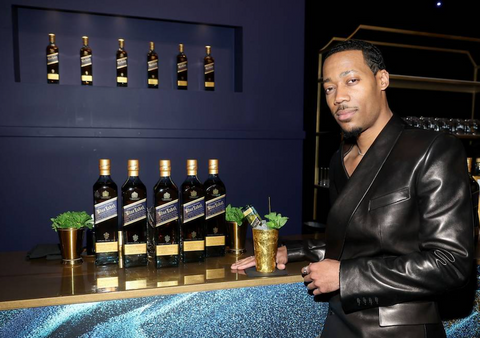 tyler james williams celebrates the th emmy awards with a signature johnnie walker blue label cocktail at the governors gala on monday jan at the la convention center in los angeles