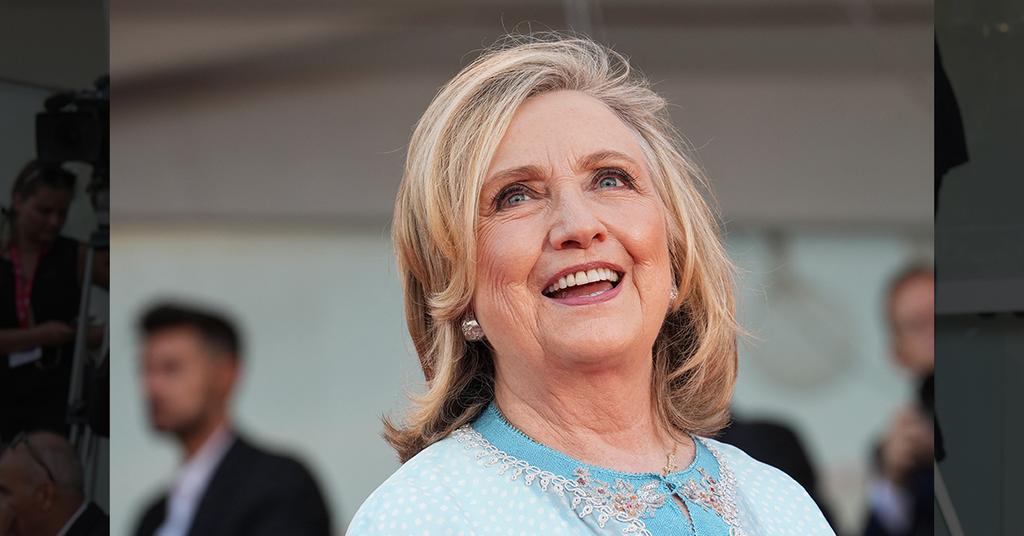 Hillary Clinton All Smiles In Recycled Caftan After Trump's FBI Raid