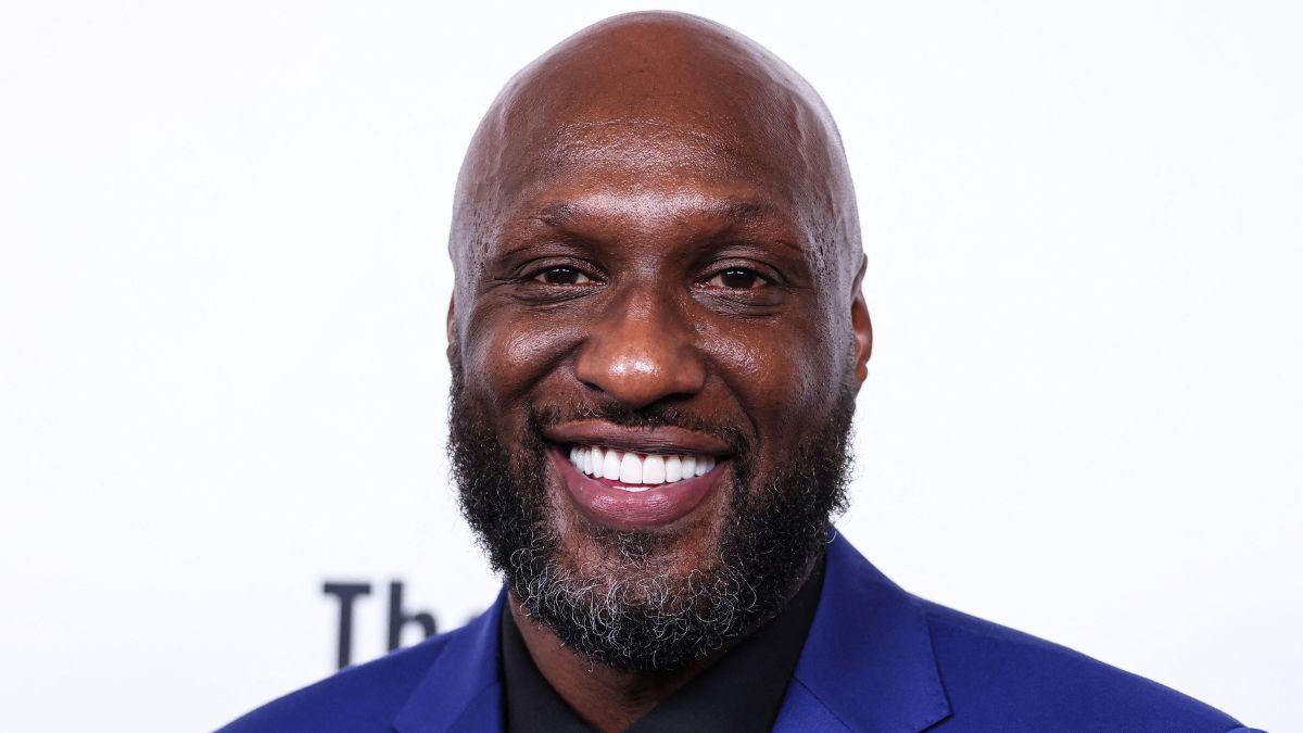 image of Odom kept a low profile while sitting at a table and enjoying the night out.