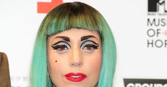 woman with green hair and eyeshadow