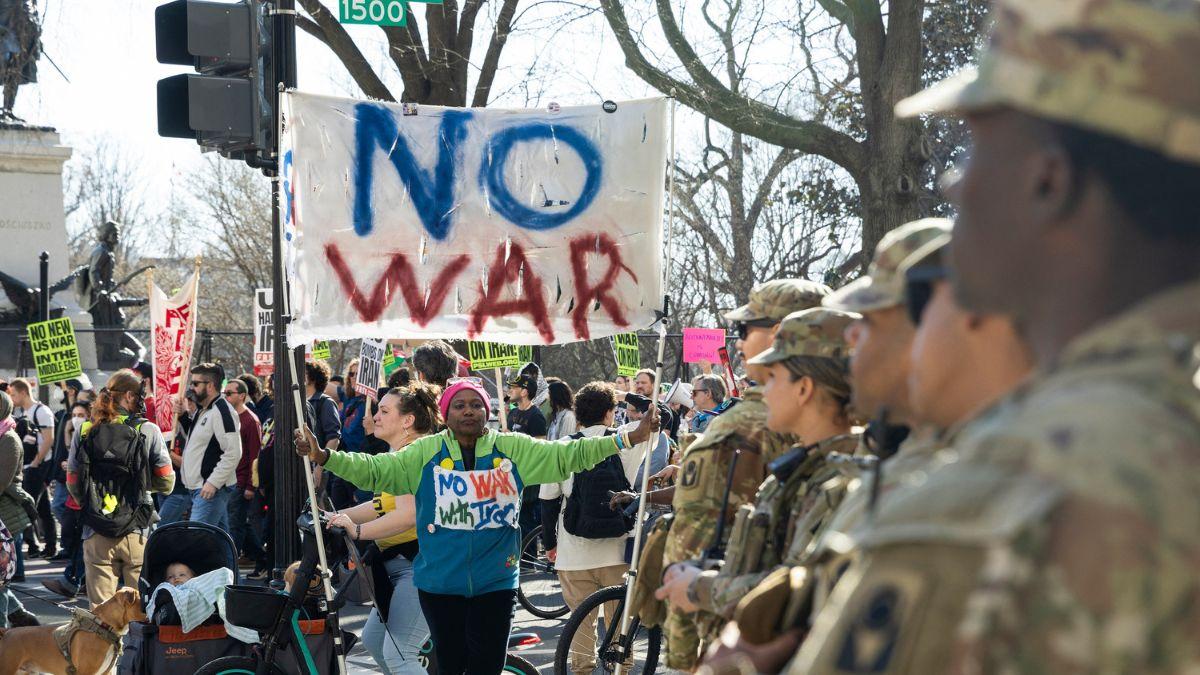 A photo of protestors of the Iranian war