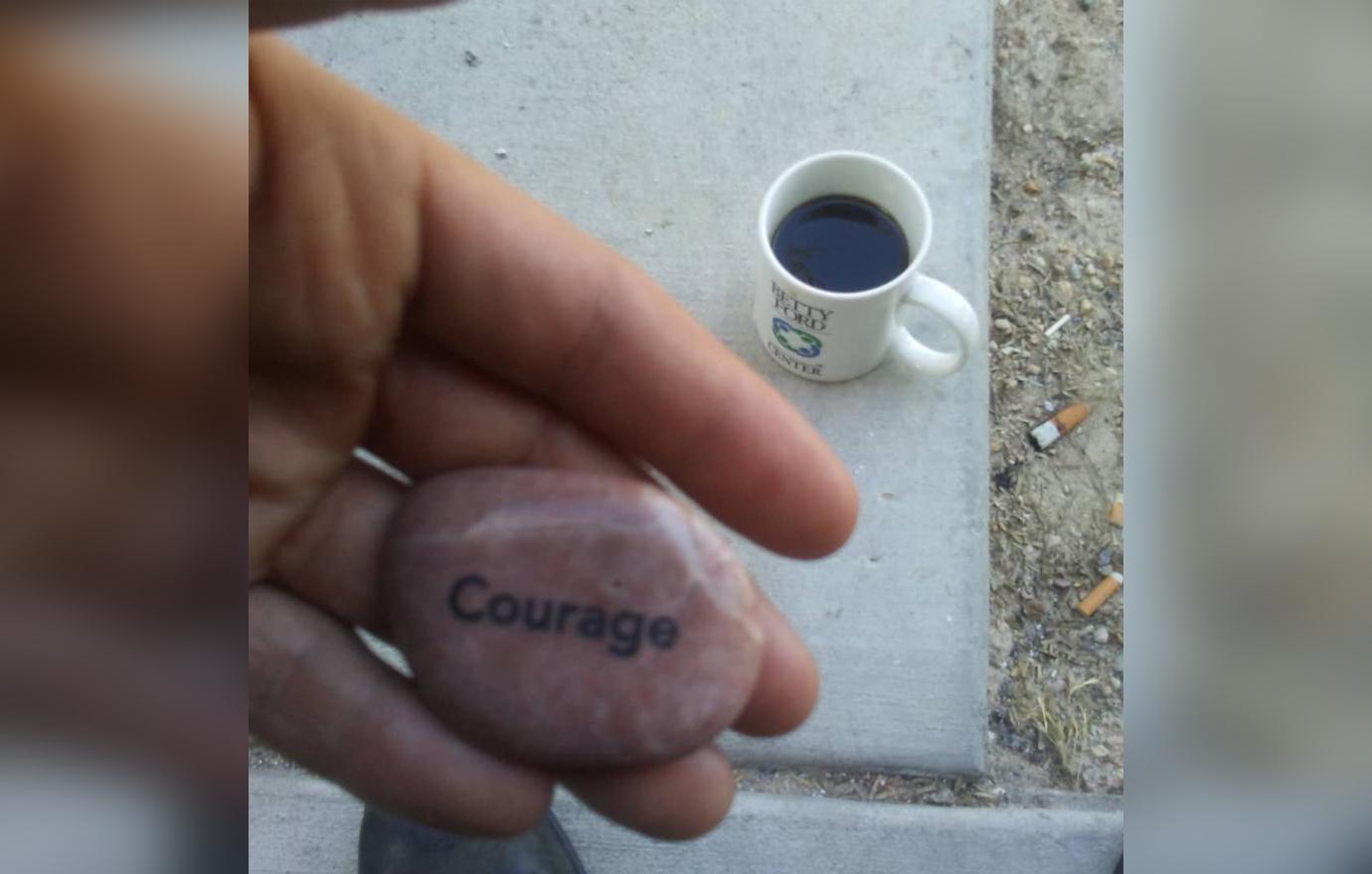 Matt Brown takes a photo of his pet stone and coffee.