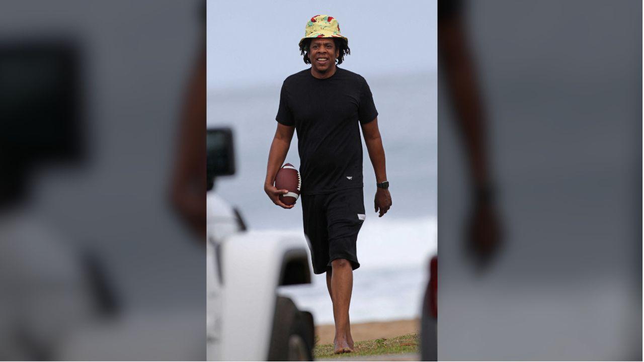 Jay-Z was spotted strolling on a beach in Hawaii in 2020 with a football