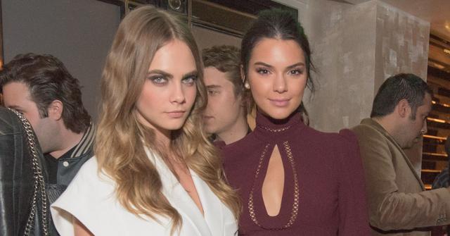 Cara Delevingne and Kendall Jenner pose together at a party