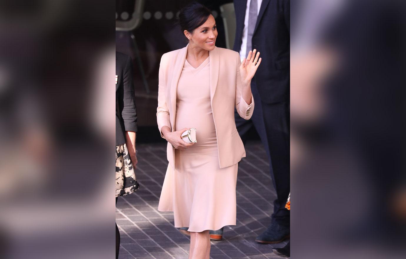 Pregnant Meghan Markle Cradles Stomach During Visit To Royal Theatre