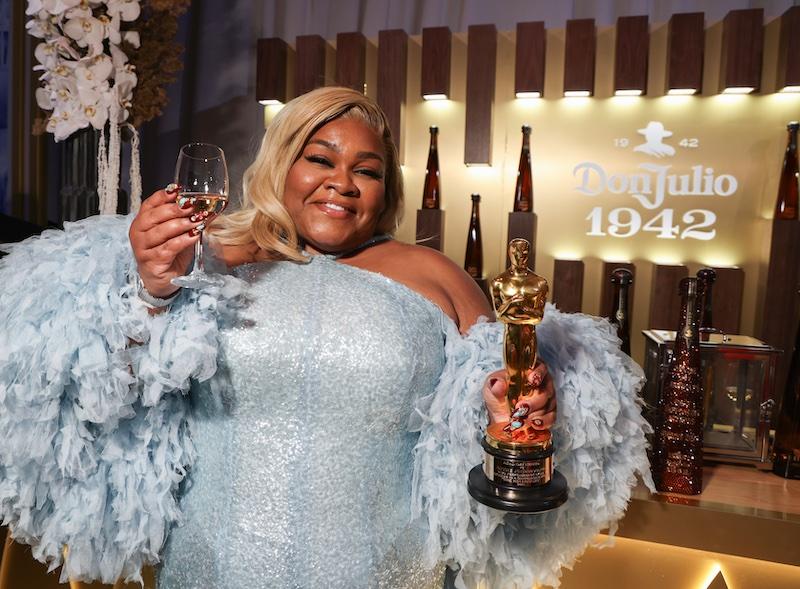 davine joy randolph raises a glass with tequila don julio  at the governors ball after the award ceremony