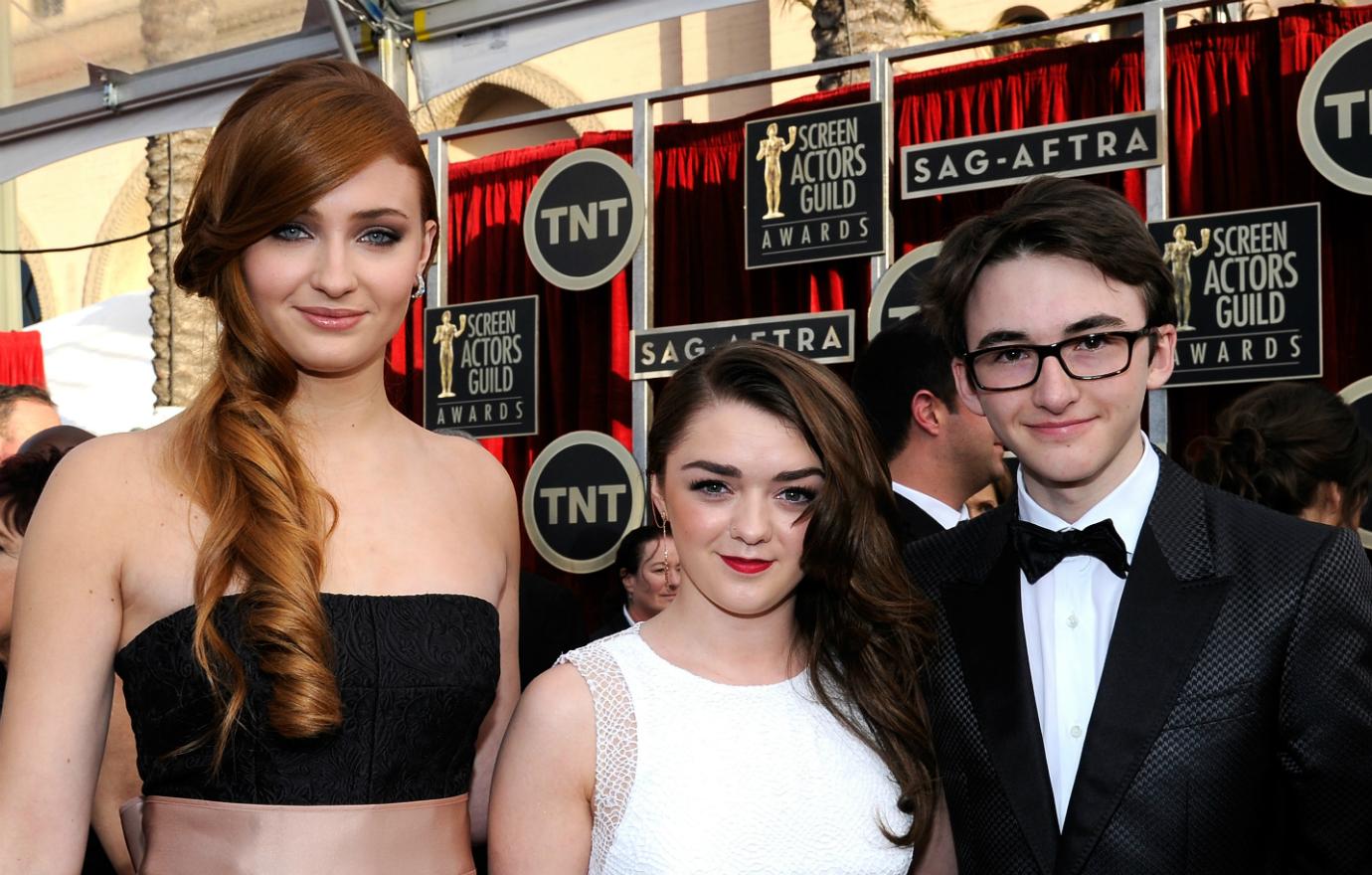 Sophie Turner, Maisie Williams and Isaac Hempstead-Wright, attend the 20th Annual Screen Actors Guild Awards at The Shrine Auditorium on January 18, 2014 in Los Angeles, California.