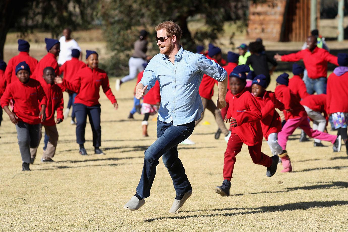 Prince Harry Plays With Children