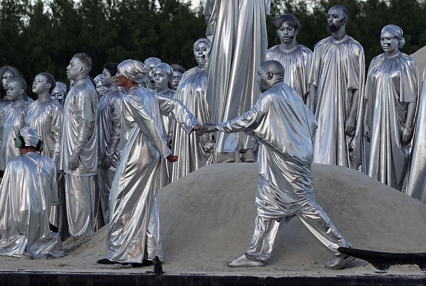 Kanye West Wears Silver Body Paint & Robe For Miami Opera