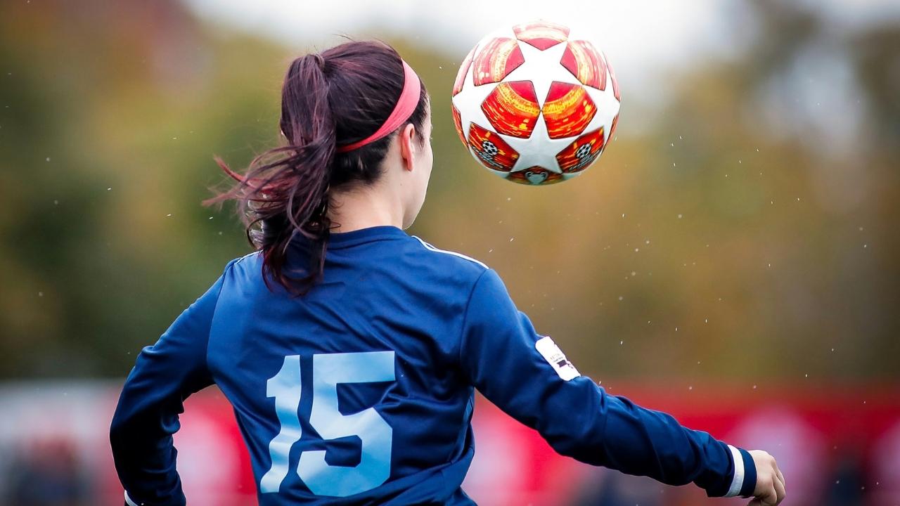 The janitor took photos of players of the women's soccer team.