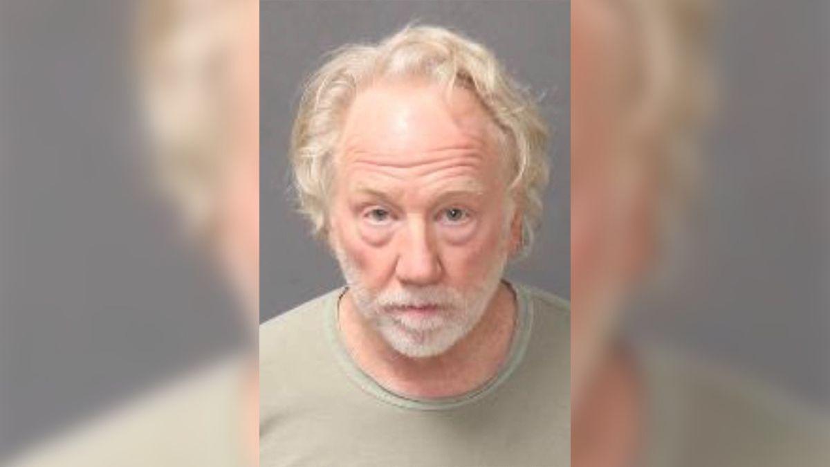 A mugshot of Timothy Busfield.