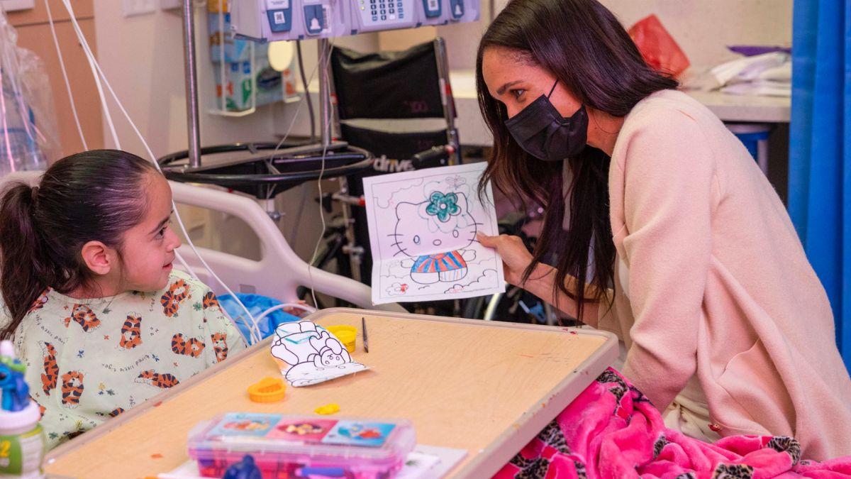 Markle posed at the bedside of a seriously ill child in her latest publicity attempt.