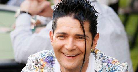 Smiling Corey Feldman Wearing Muticolor Floral Blazer