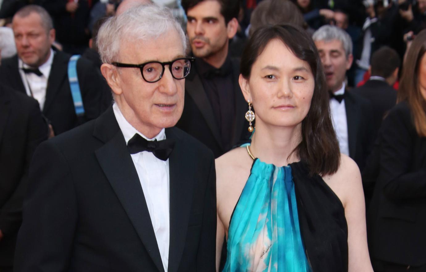 Woody Allen, in a classic tux, held hands with his wife, Soon-Yi Previn, as she wore a sleeveless blue, black and white dress.