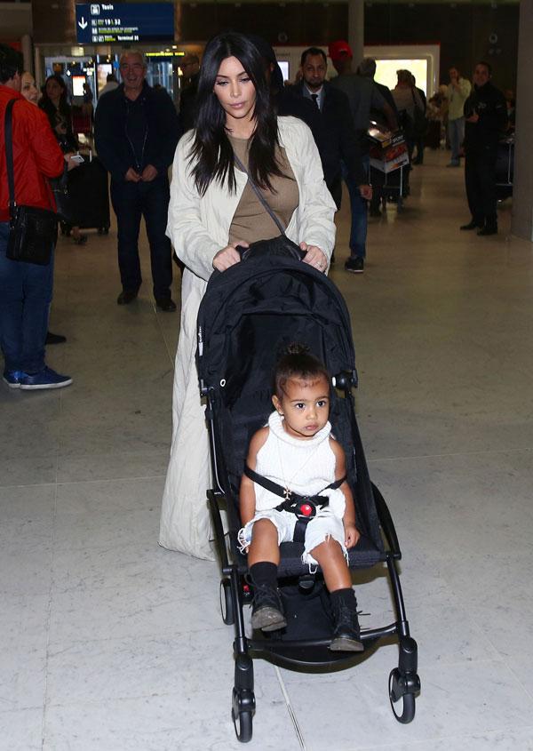 Kim Kardashian Kanye North West Photos -- Toddler Smiles As Family Arrives In Paris