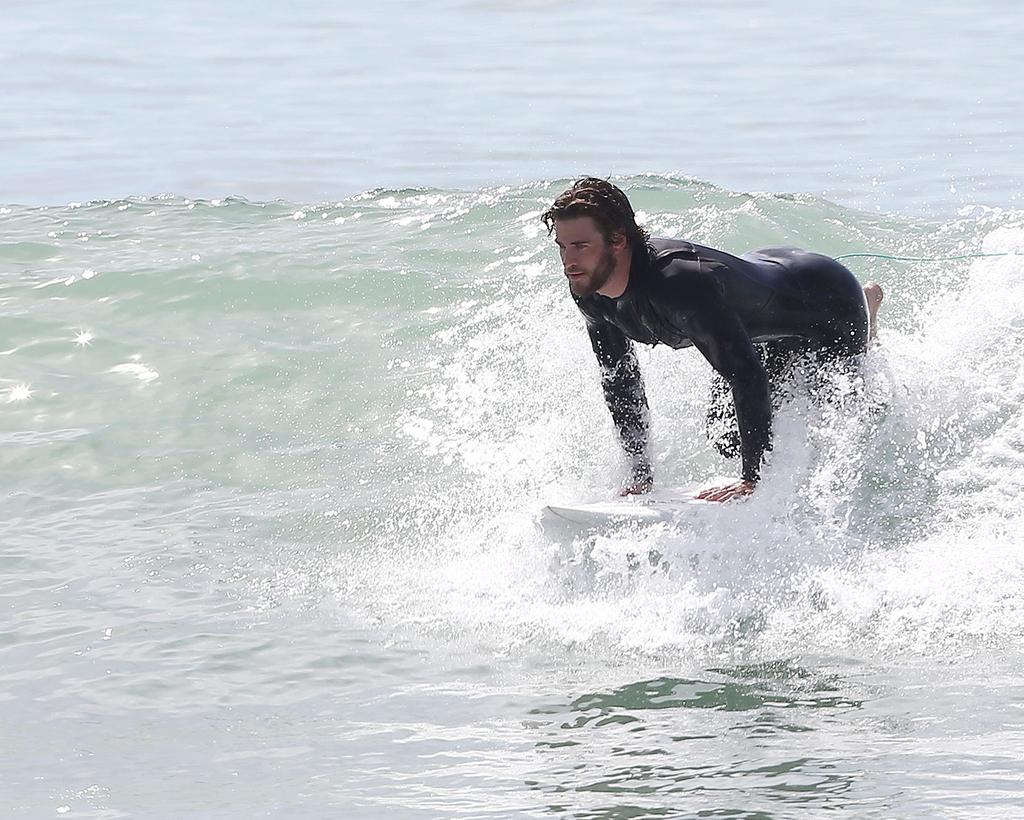 Miley Cyrus' Man Liam Hemsworth Heats Up Malibu During Surfing Session