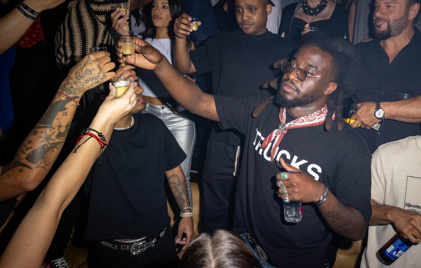 shaboozey takes a shot of jack daniels at eeven miami on june   photo credit alexander tamago getty images