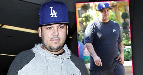 Rob Kardashian Looking Heavy in Gray Sweatshirt and LA Baseball cap, Inset In Blue T-Shirt With LA Baseball Cap, Checking Into Health Farm Amid Weight Woes