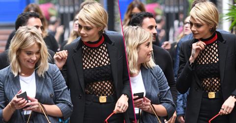 Ashley showed co star Cara Delevingne her phone as they both appeared to laugh as they attended press during the TIFF 2018 festival in Toronto.