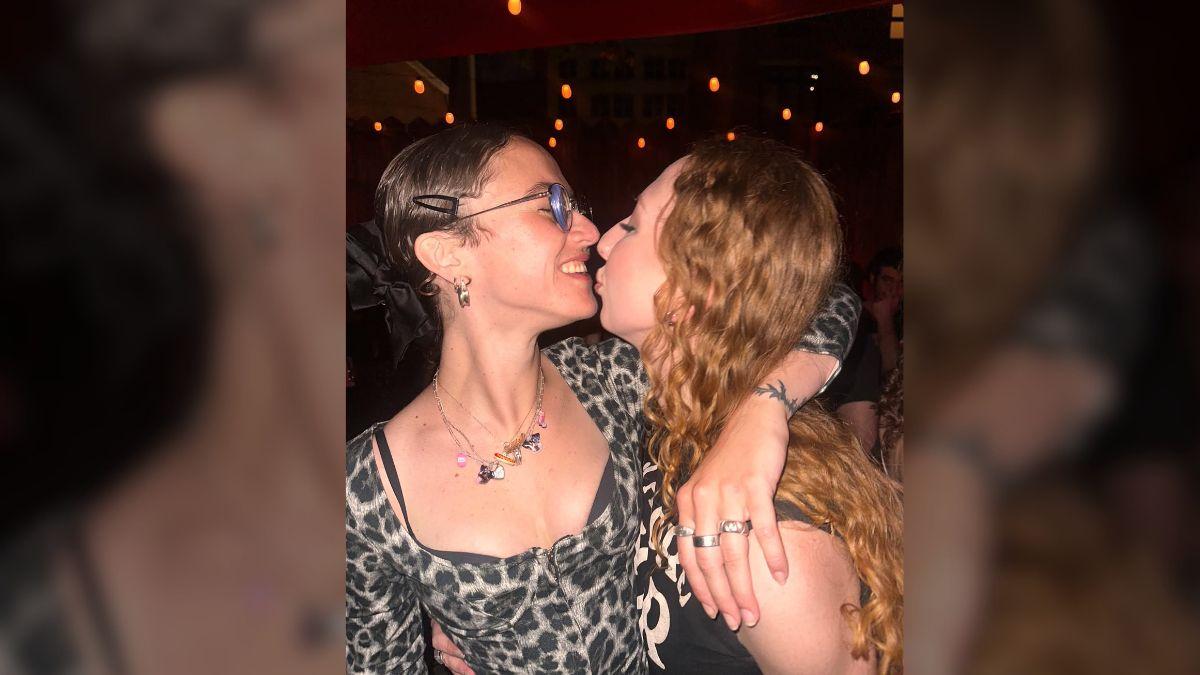 image of One photo showed the model getting cozy with friend Sophia Hodgkinson during the festivities.