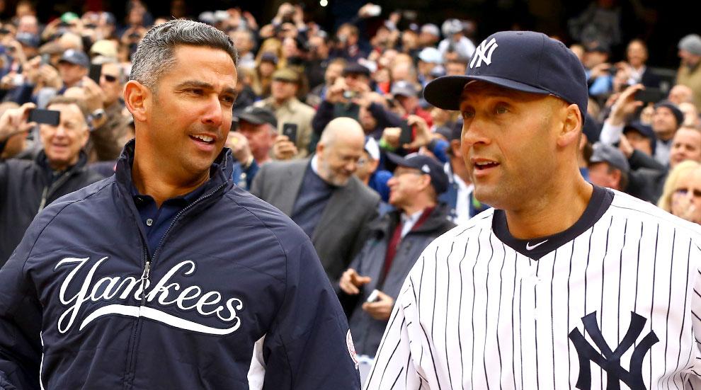 Closeup portrait of New York Yankees Jorge Posada with son at