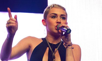 //miley cyrus on stage revealing outfit